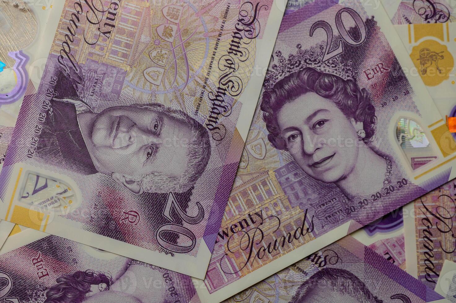 20 pound sterling bank notes closeup view business background photo