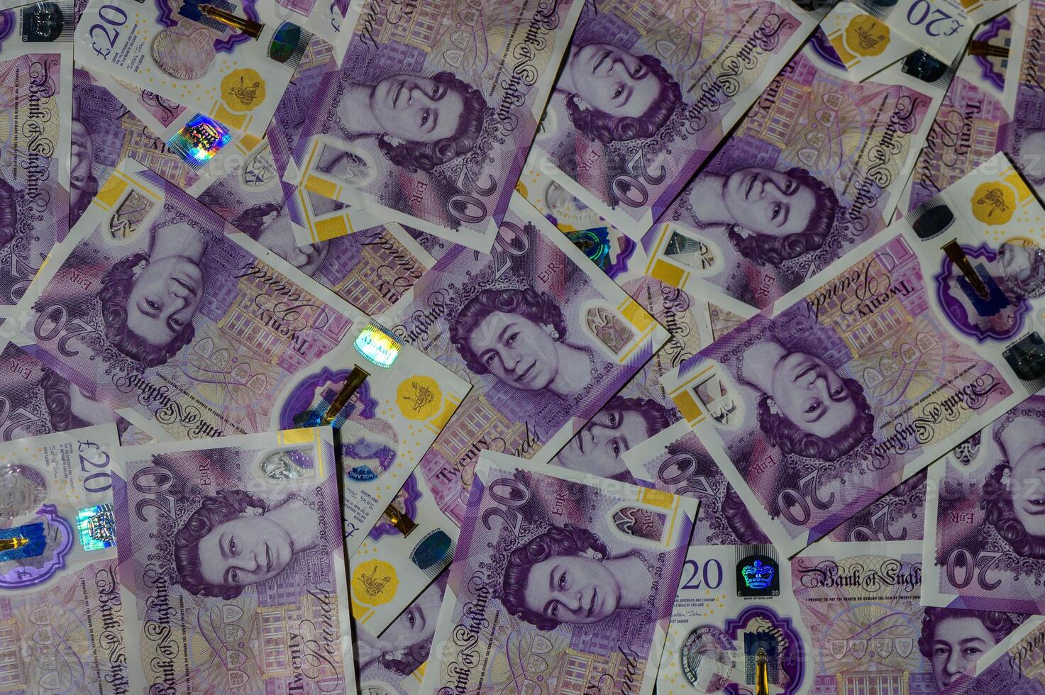 Pile of Twenty Pound Notes photo
