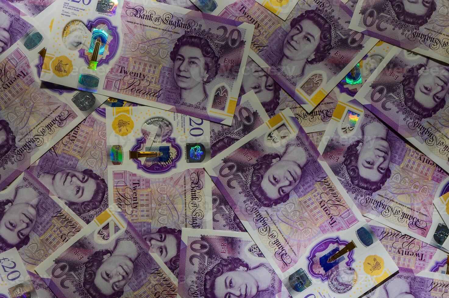 Pile of Twenty Pound Notes photo