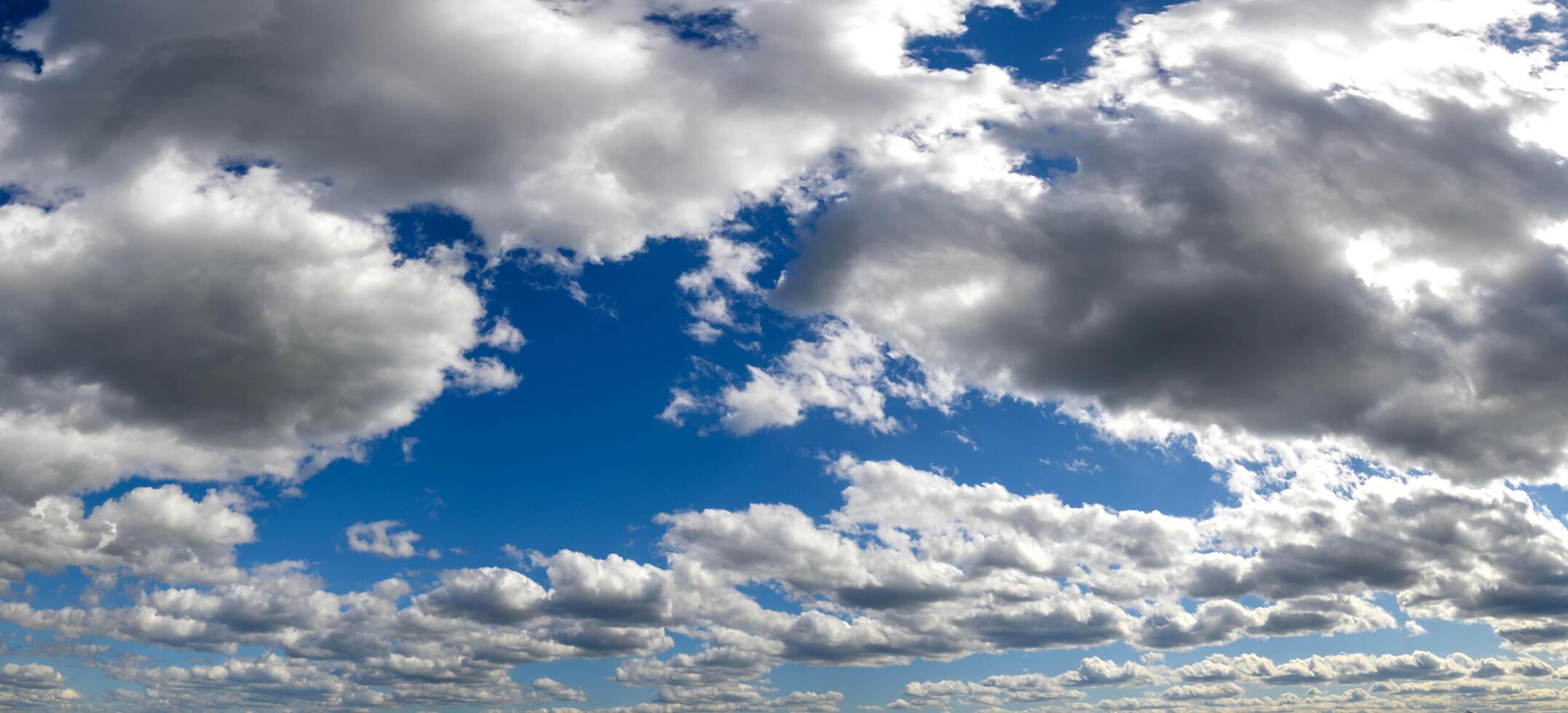 Blue sky clouds background. Beautiful landscape with clouds and orange sun on sky photo
