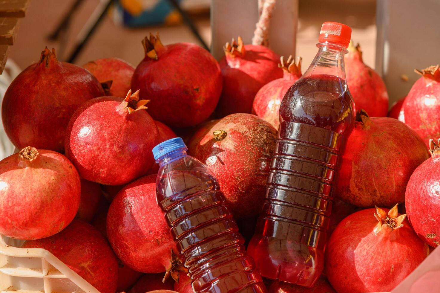 Ripe pomegranates with glass of pomegranate juice photo