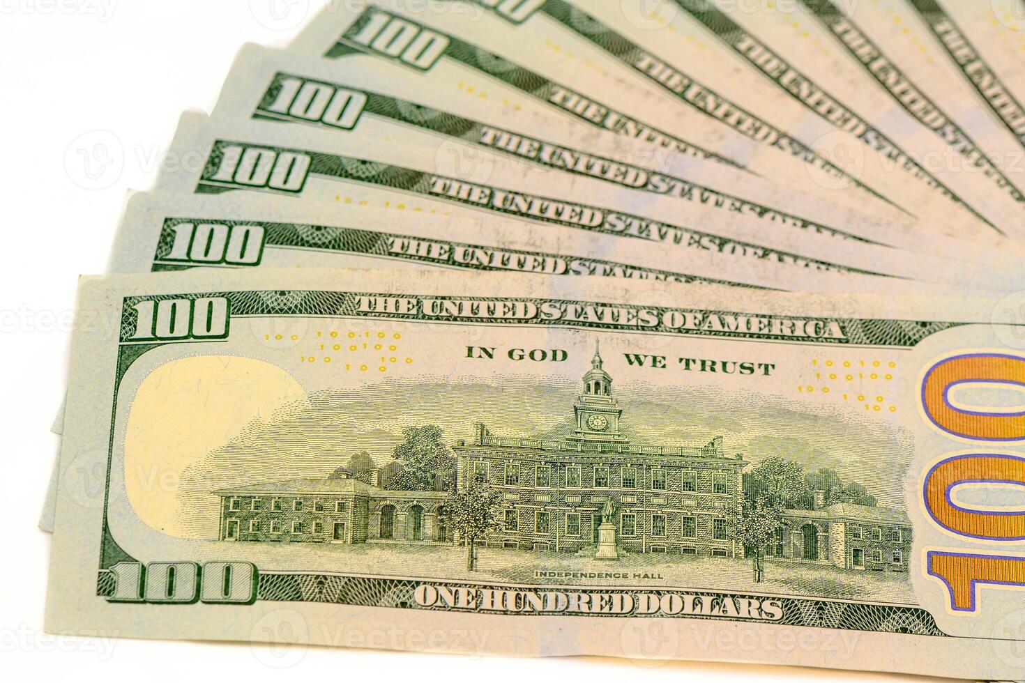 Hundred dollar bills of a new sample lie in a fan shaped photo