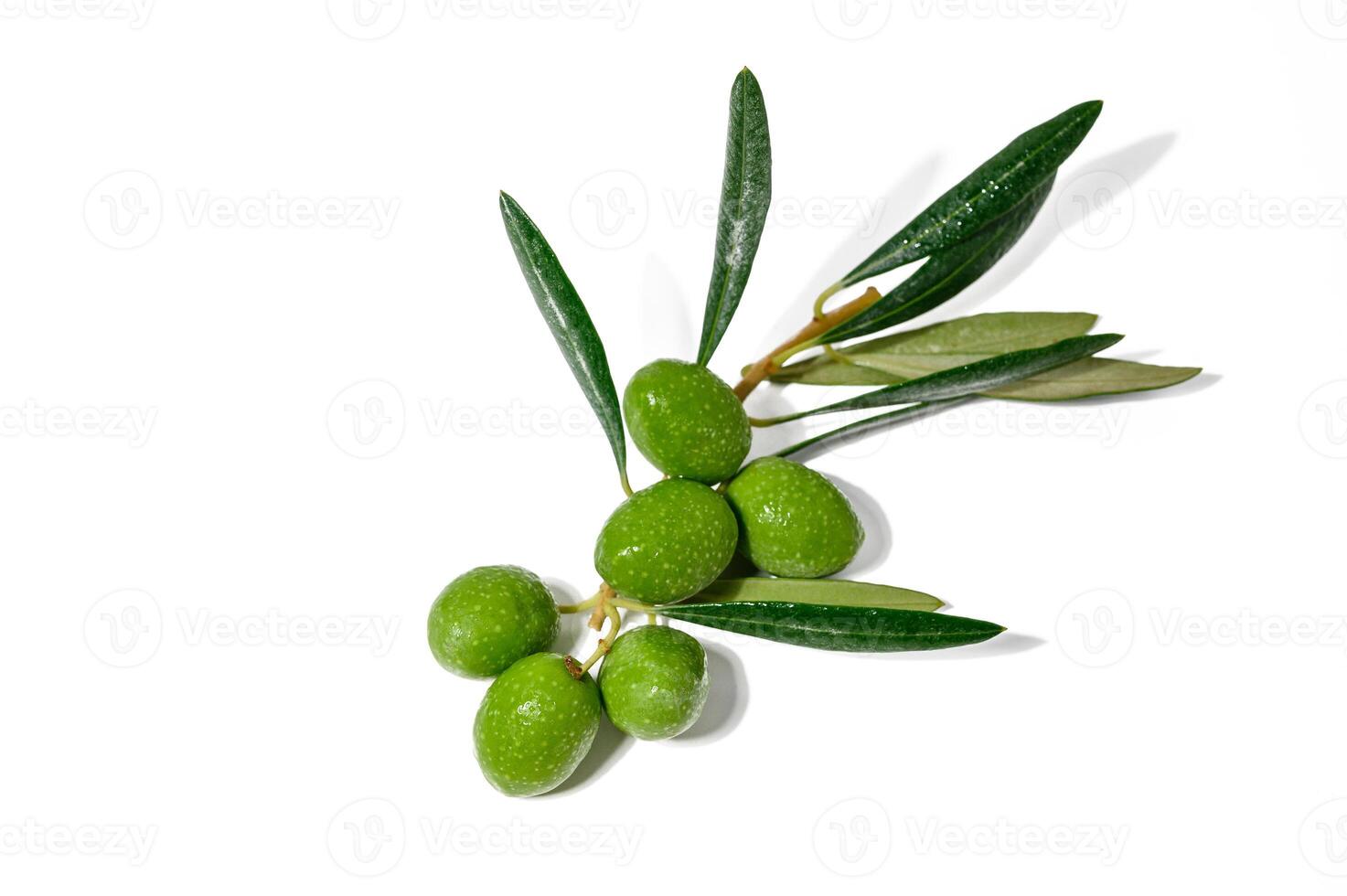 Fresh green olives and leaves pattern on white background photo