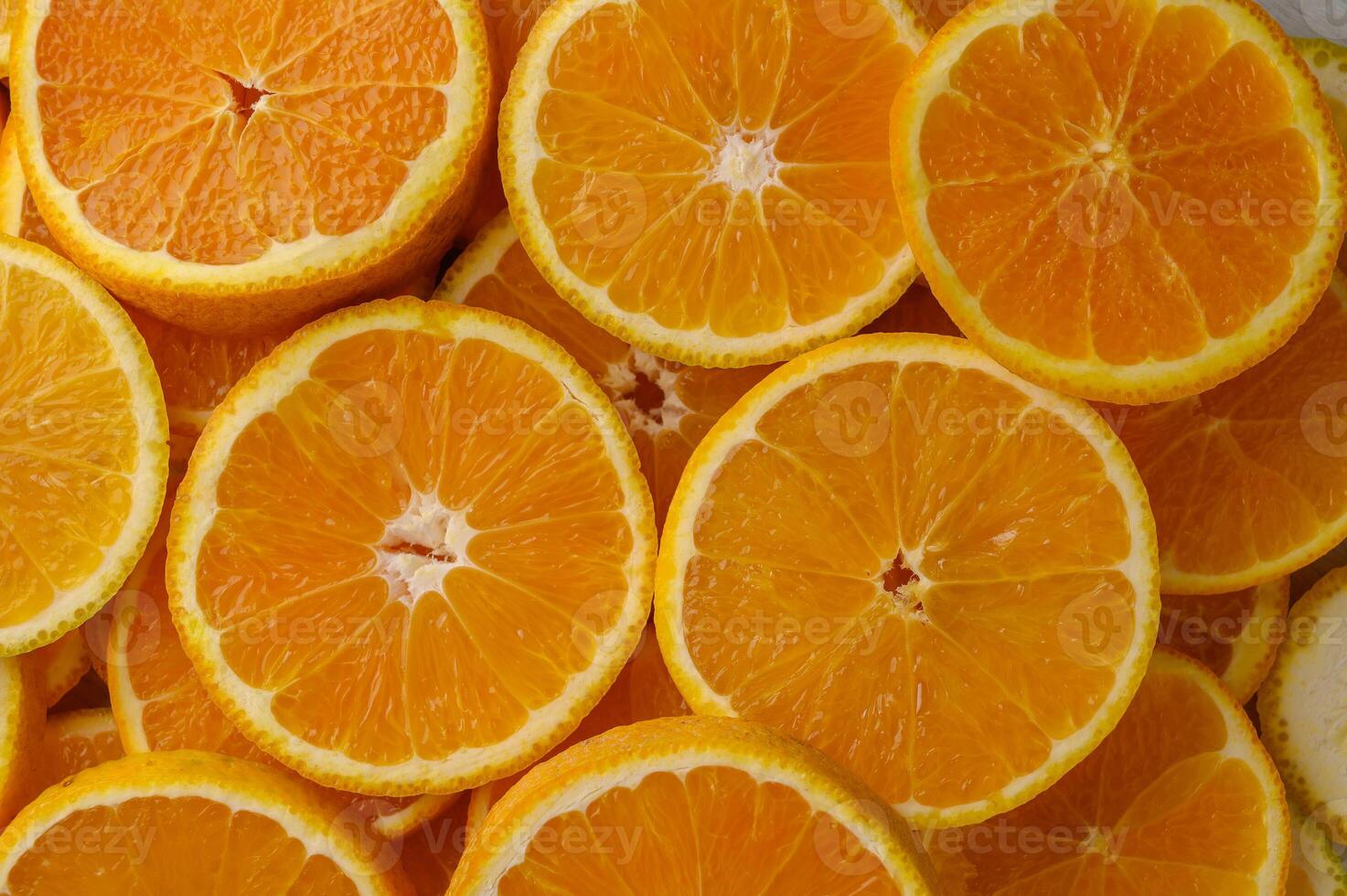 Pattern of slices citrus-fruit of oranges on beige background photo