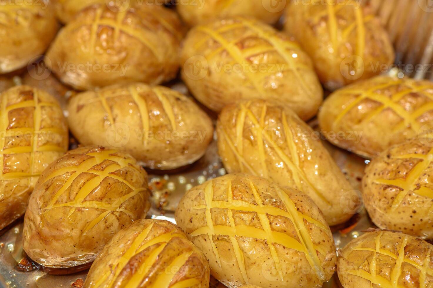 Hot buttered jacket baked Potatoes close up with steam photo