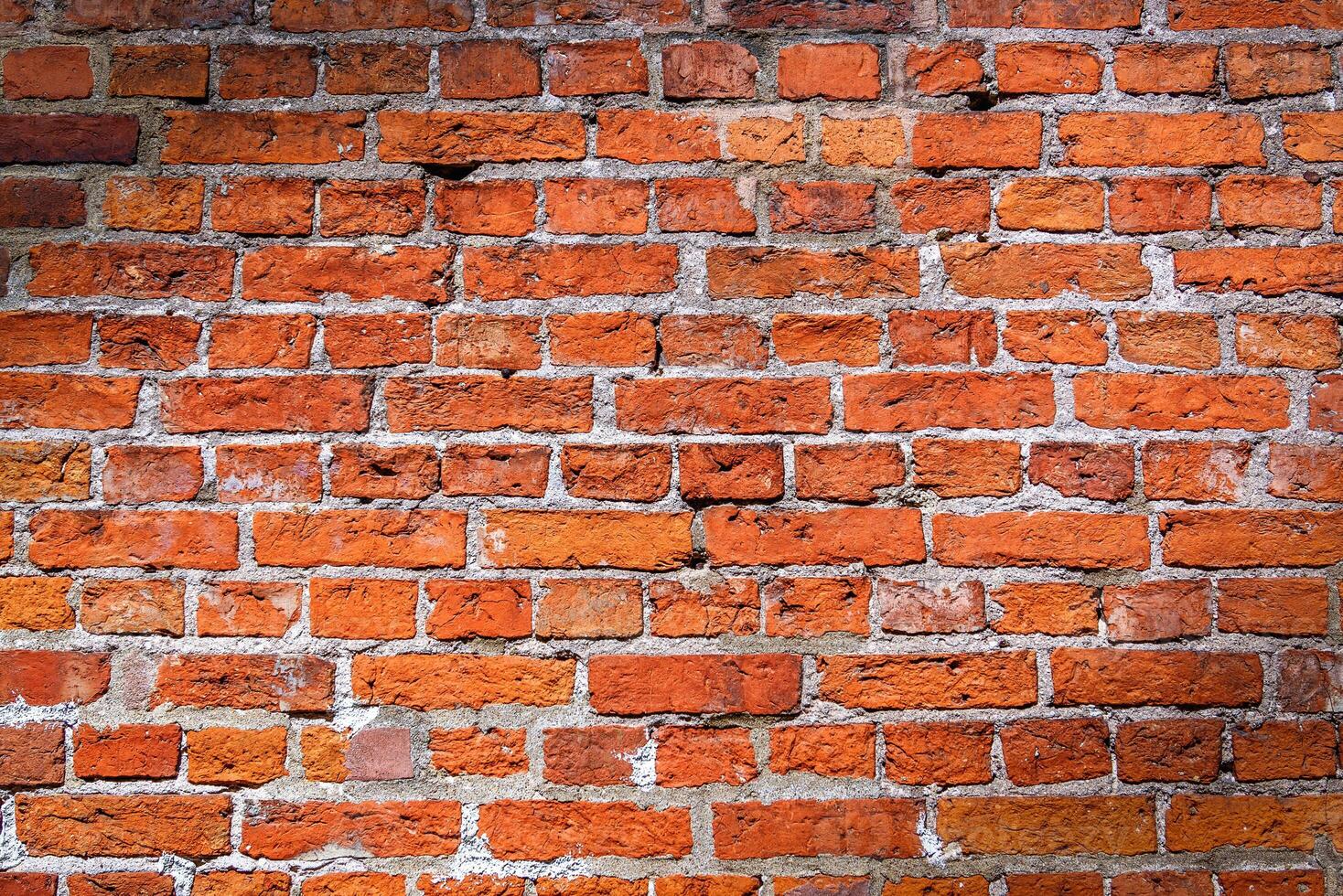 Red brick wall with vignette texture background photo