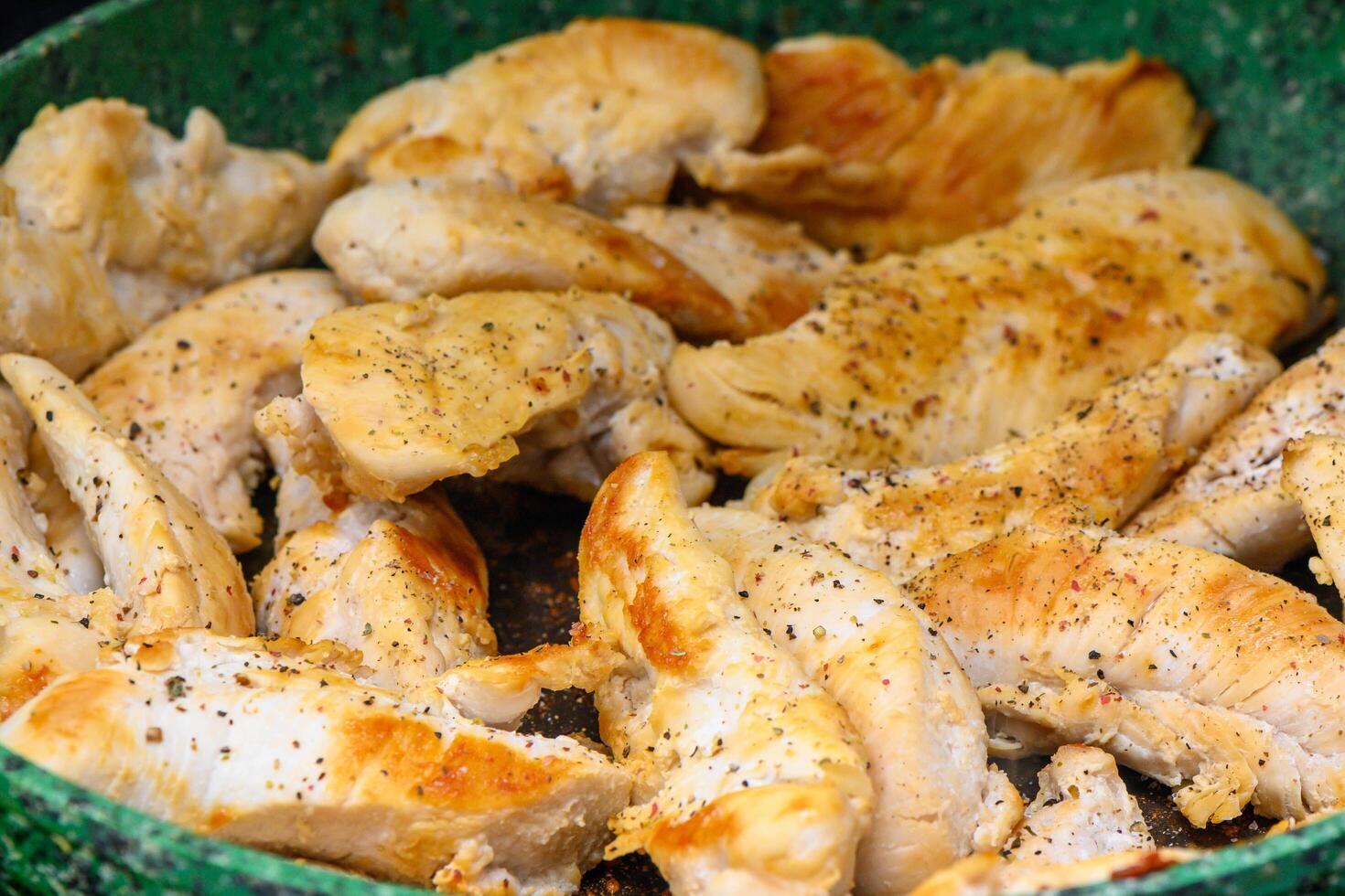 Baked chicken thighs with sauce and vegetables photo
