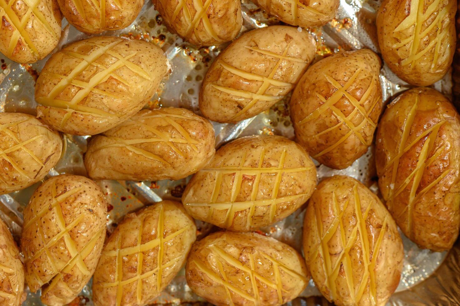 baked potatoes whole in their skins photo
