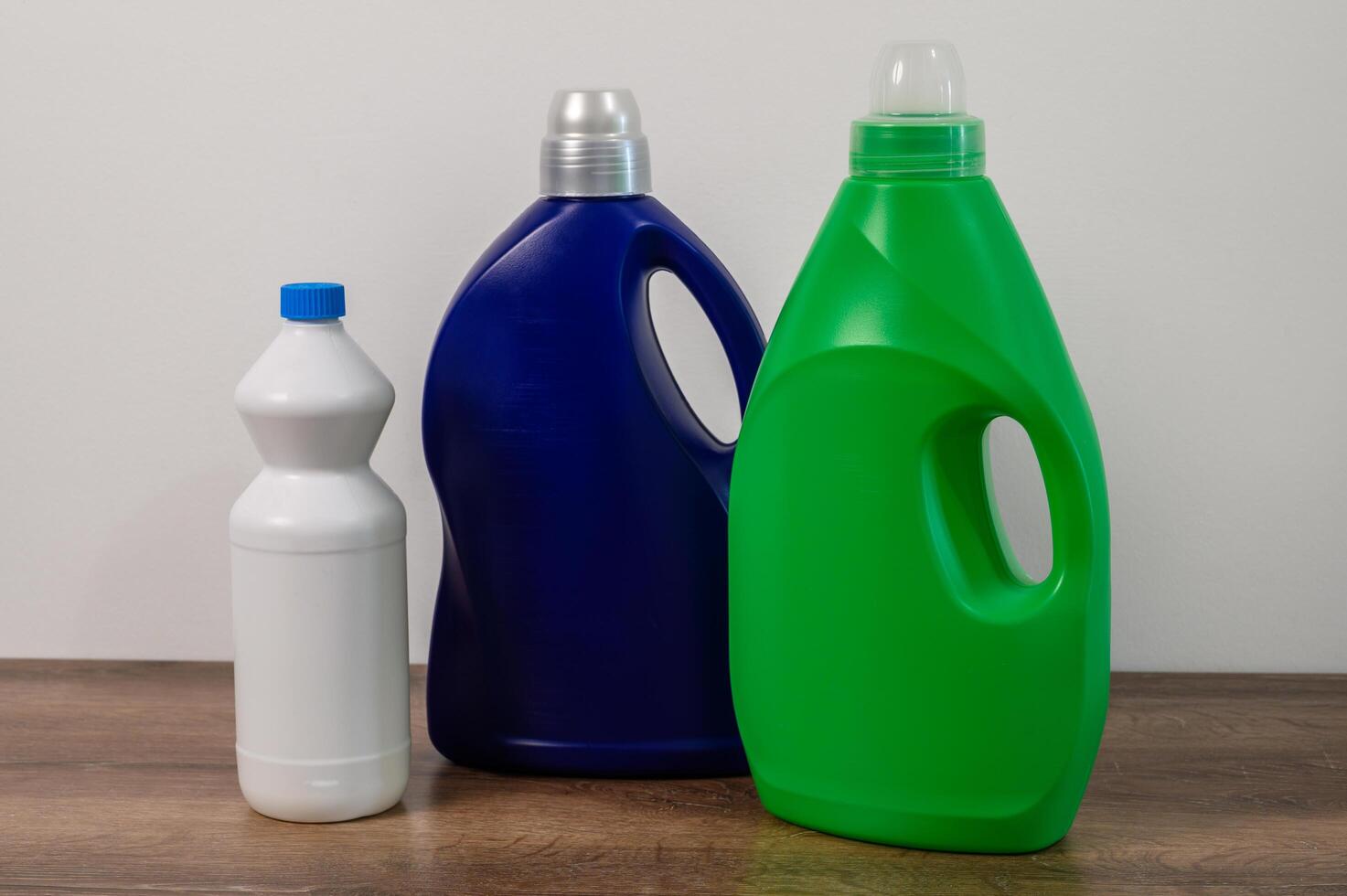 multicolored bottles with household chemicals photo