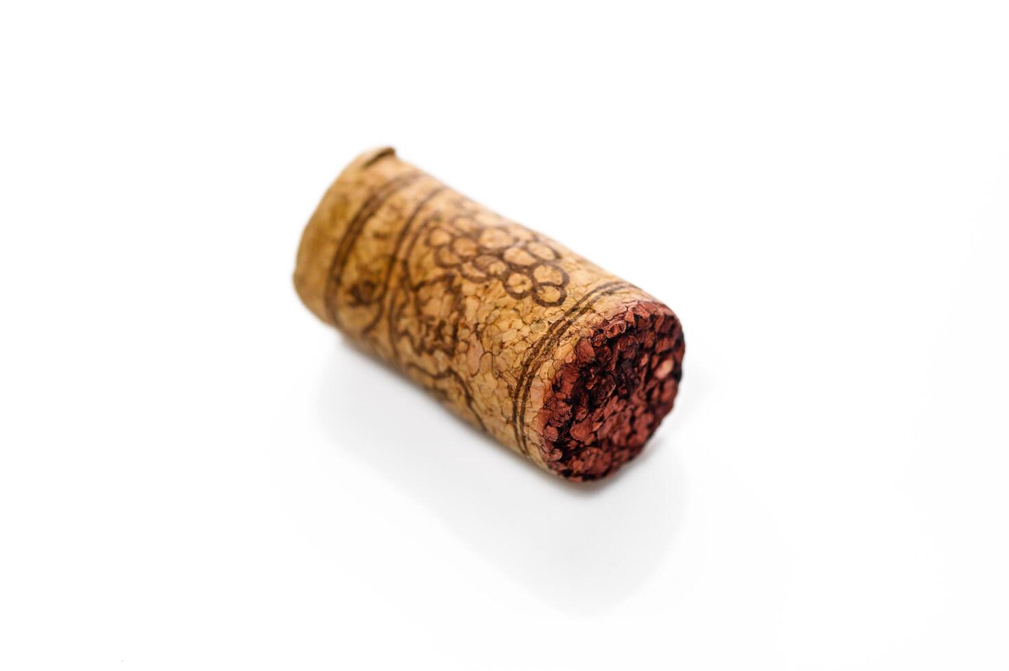 One cork stopper for wine bottle over white background photo