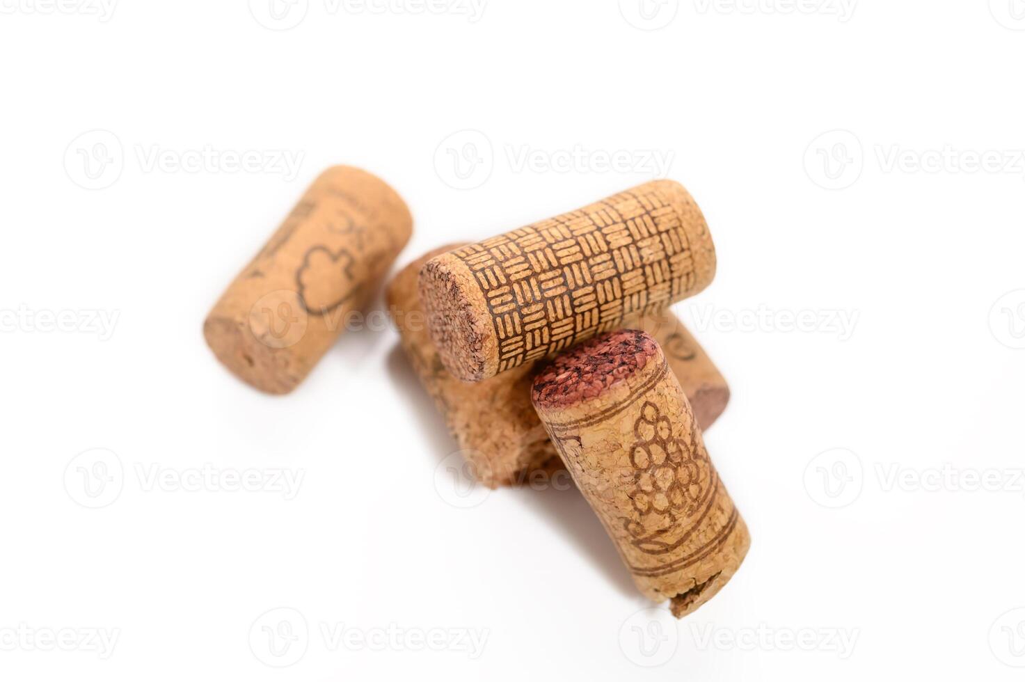 Heap of old wine corks on white background. Studio photography photo