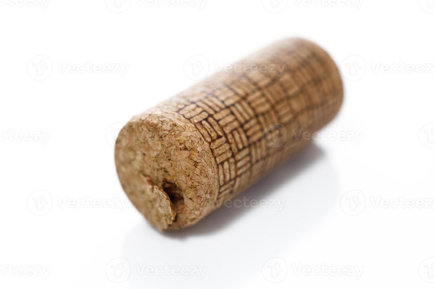 Old wine cork isolated on white photo