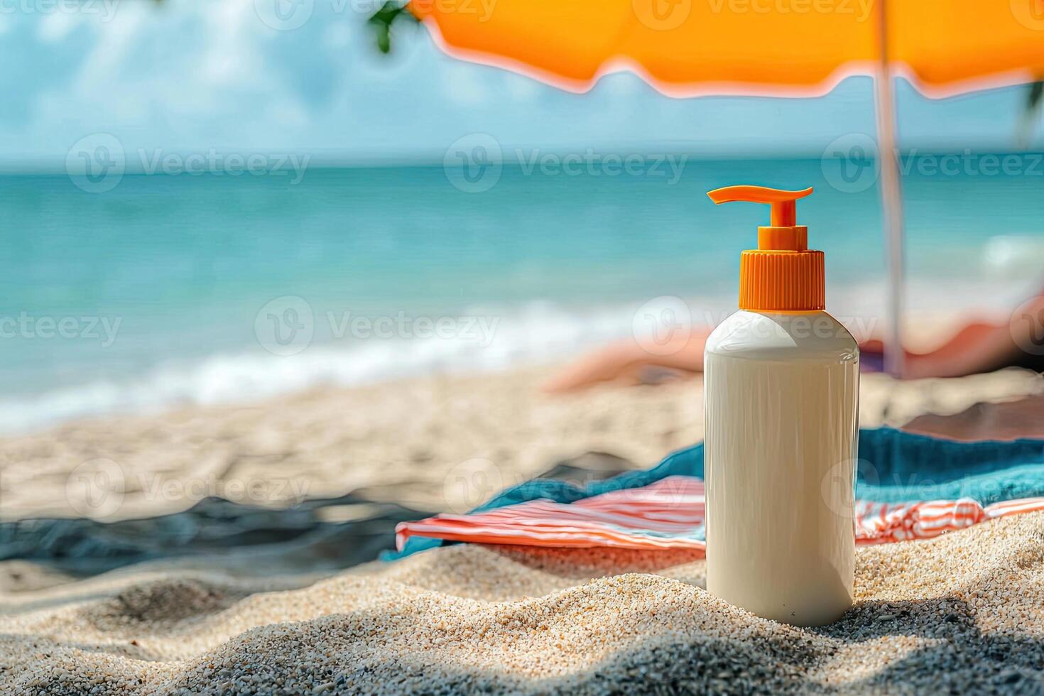 Sunscreen bottle on sandy beach with umbrella and blue sky background. Summer vacation concept photo