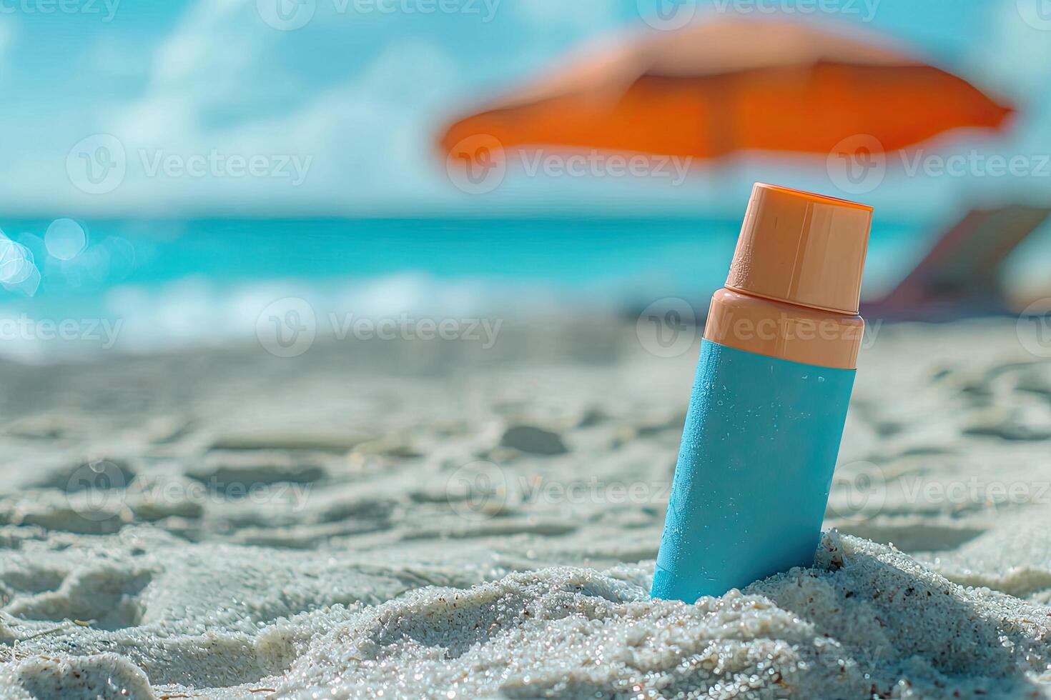 Sunscreen bottle on sandy beach with umbrella and blue sky background. Summer vacation concept photo