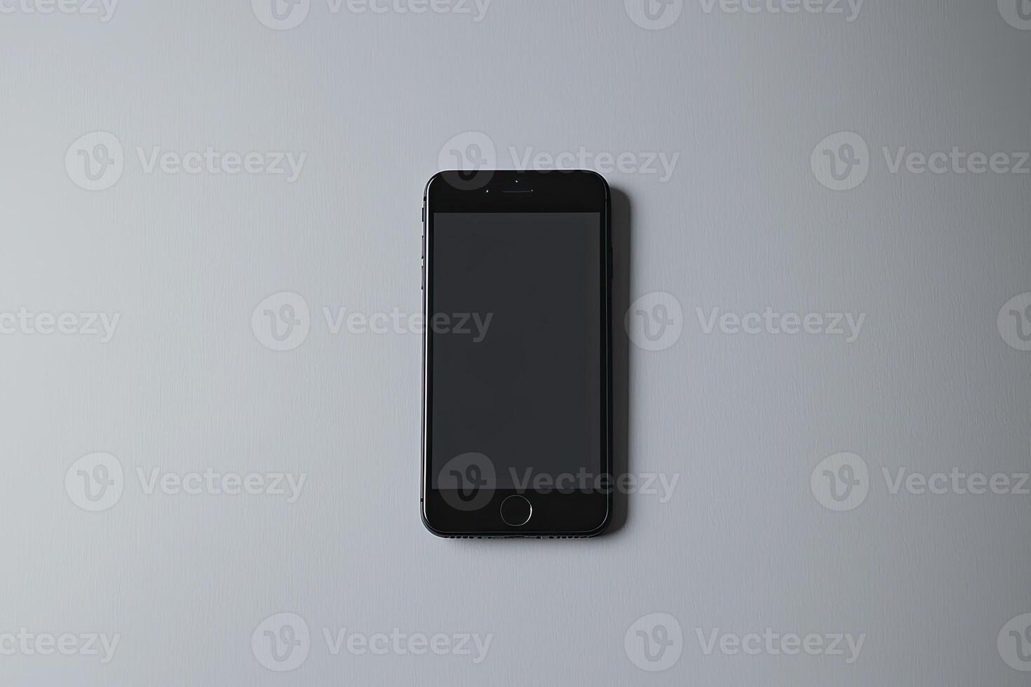 Smartphone with blank screen placed on background surface photo