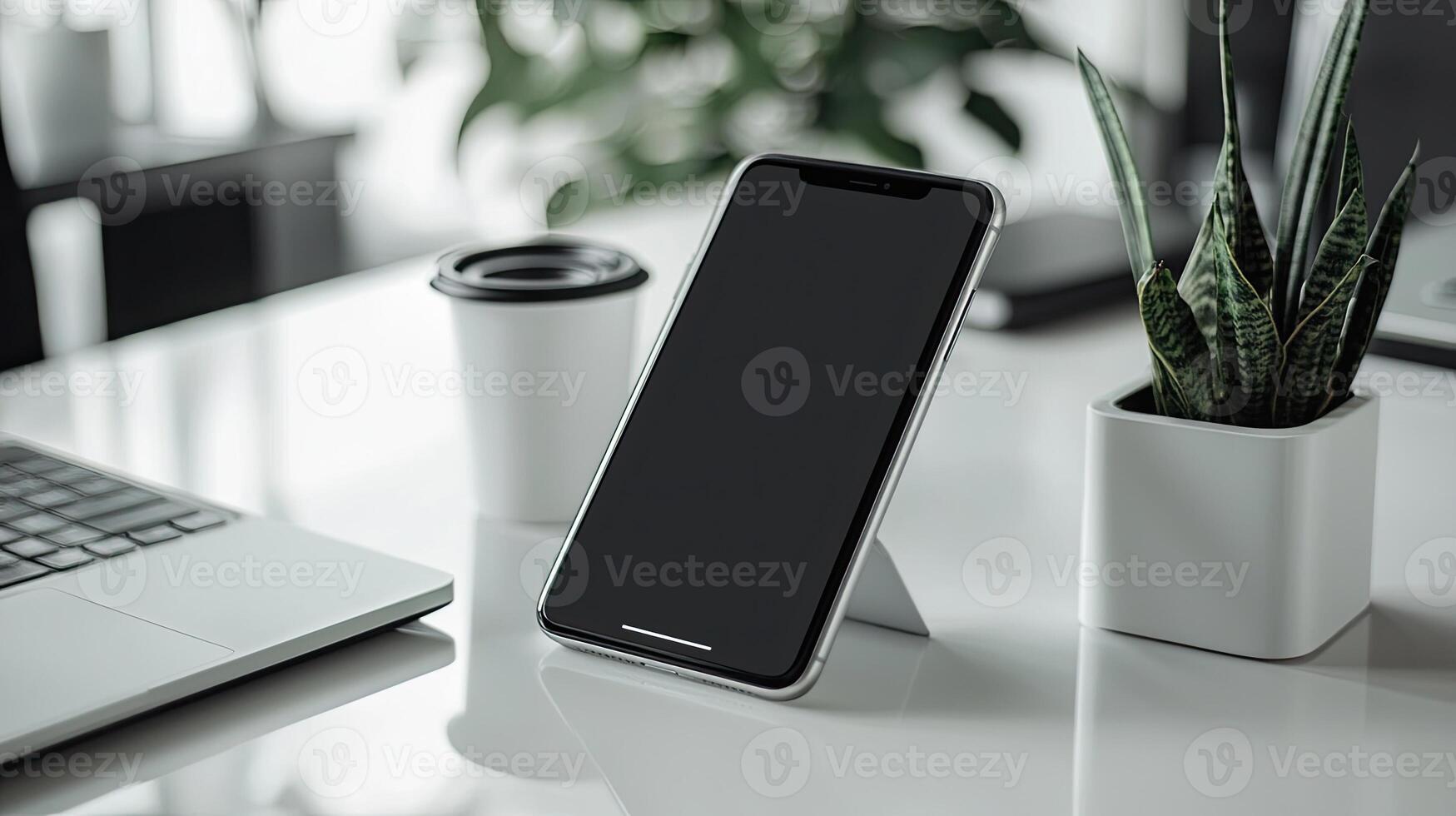 Smartphone with blank screen placed on background surface photo