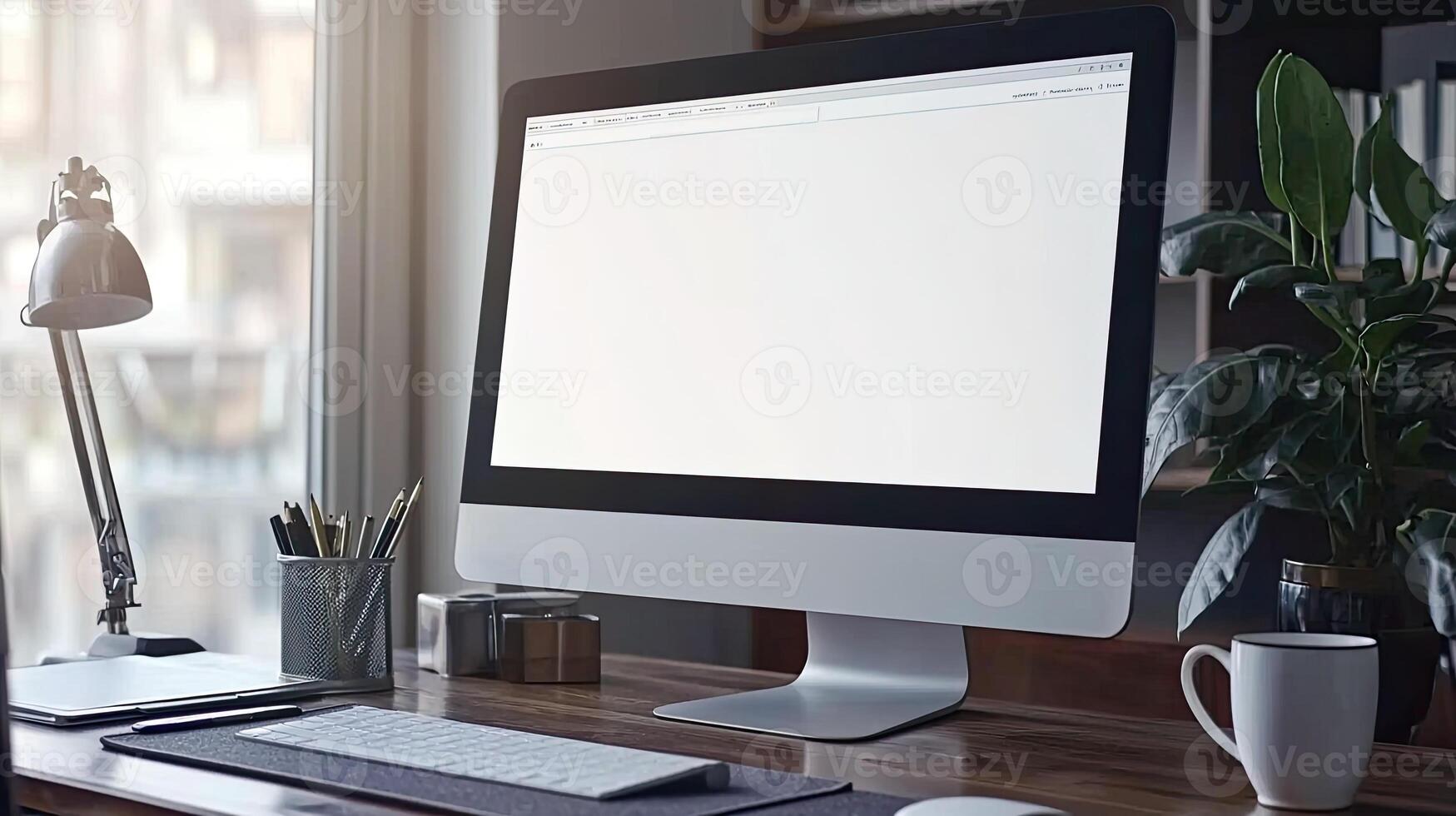 A white computer monitor close up on a table with copy space, a coffee mug, and a pen holder photo