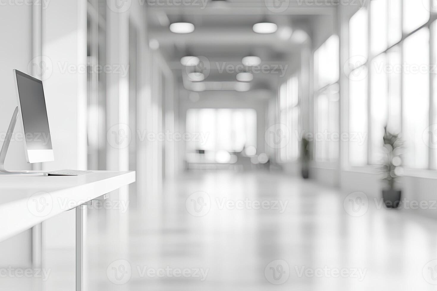 Blurred office background with a computer and white desk in a modern interior, a business work space concept, a mockup for product display presentation, with a white background photo