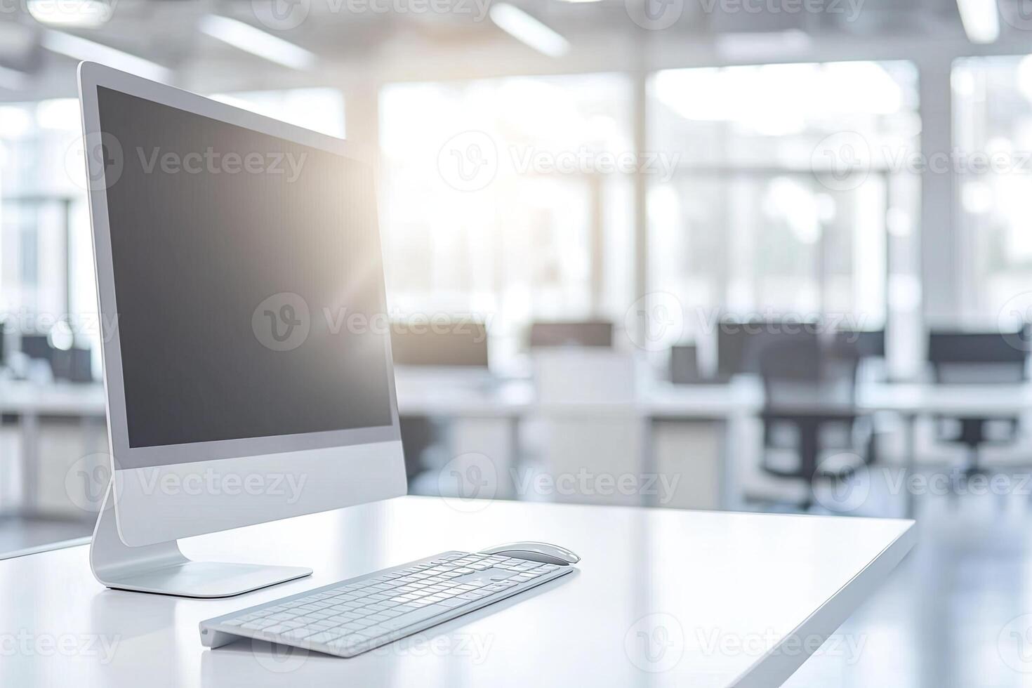 Minimalist white desk with a computer and office background, blurred business center interior in the blurred background. Mockup for design or presentation photo