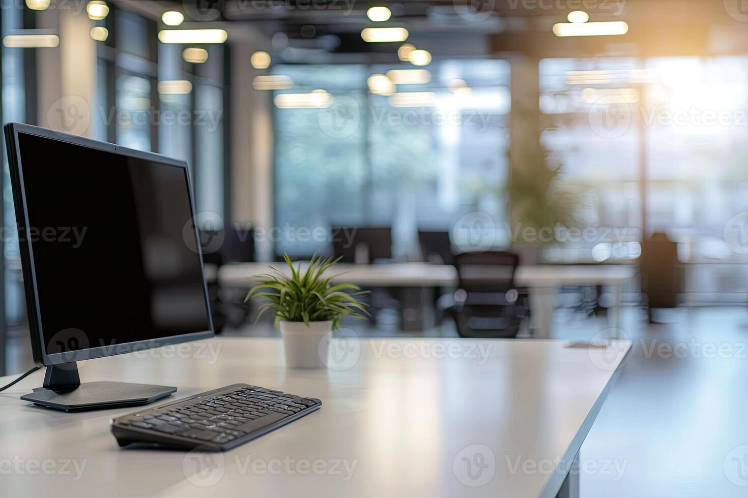 Minimalist white desk with a computer and office background, blurred business center interior in the blurred background. Mockup for design or presentation photo