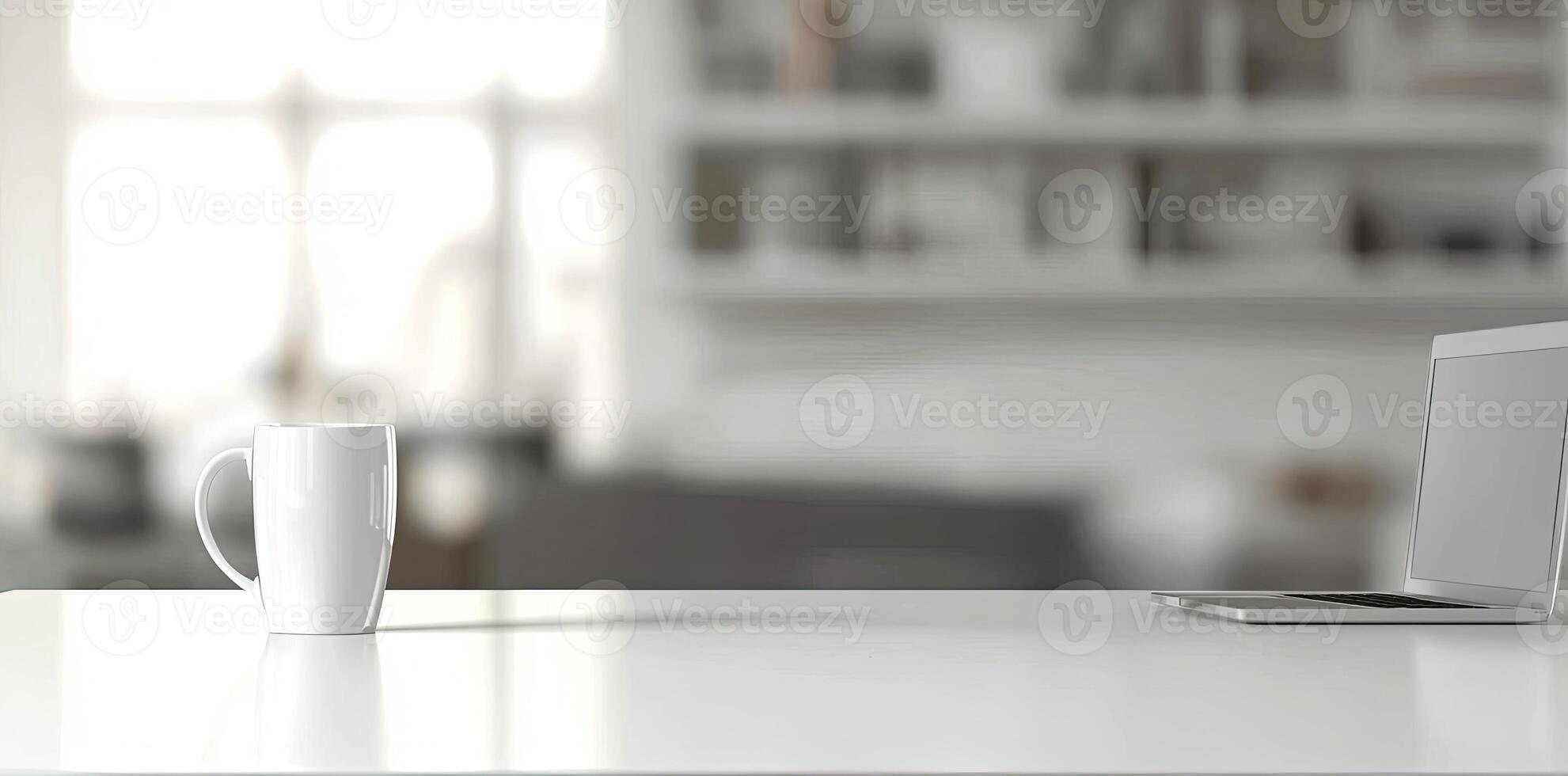 Minimalist white office desk with laptop and coffee mug on a blurred background, with space for text, representing the concept of working from home photo