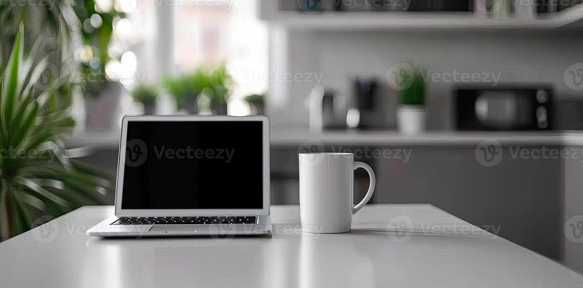 Minimalist white office desk with laptop and coffee mug on a blurred background, with space for text, representing the concept of working from home photo