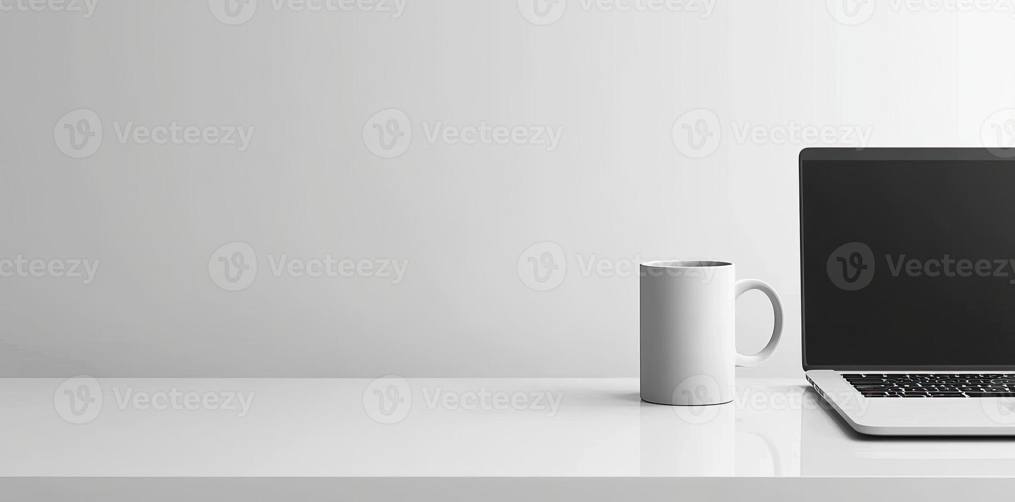 Minimalist white office desk with laptop and coffee mug on a blurred background, with space for text, representing the concept of working from home photo