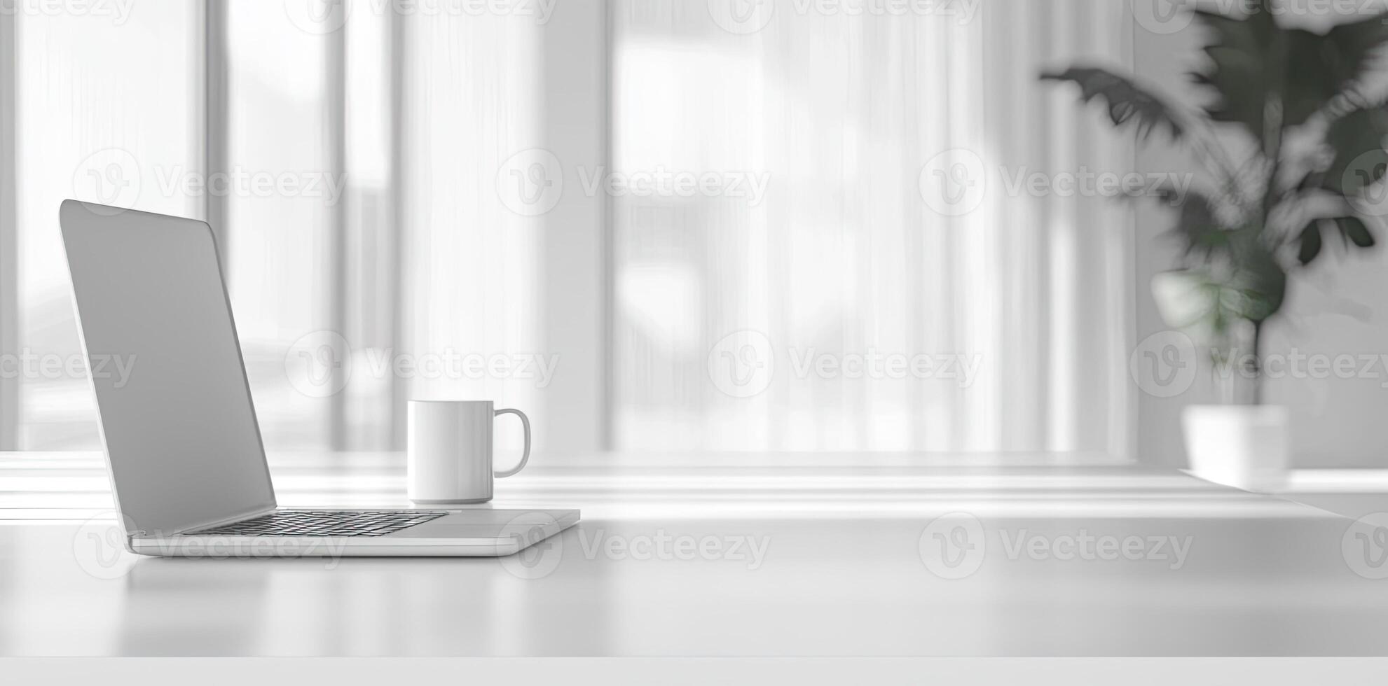 Minimalist white office desk with laptop and coffee mug on a blurred background, with space for text, representing the concept of working from home photo