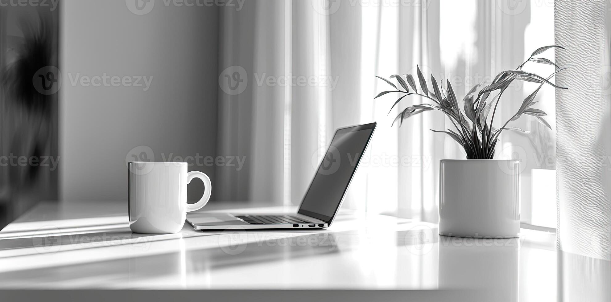 Minimalist white office desk with laptop and coffee mug on a blurred background, with space for text, representing the concept of working from home photo