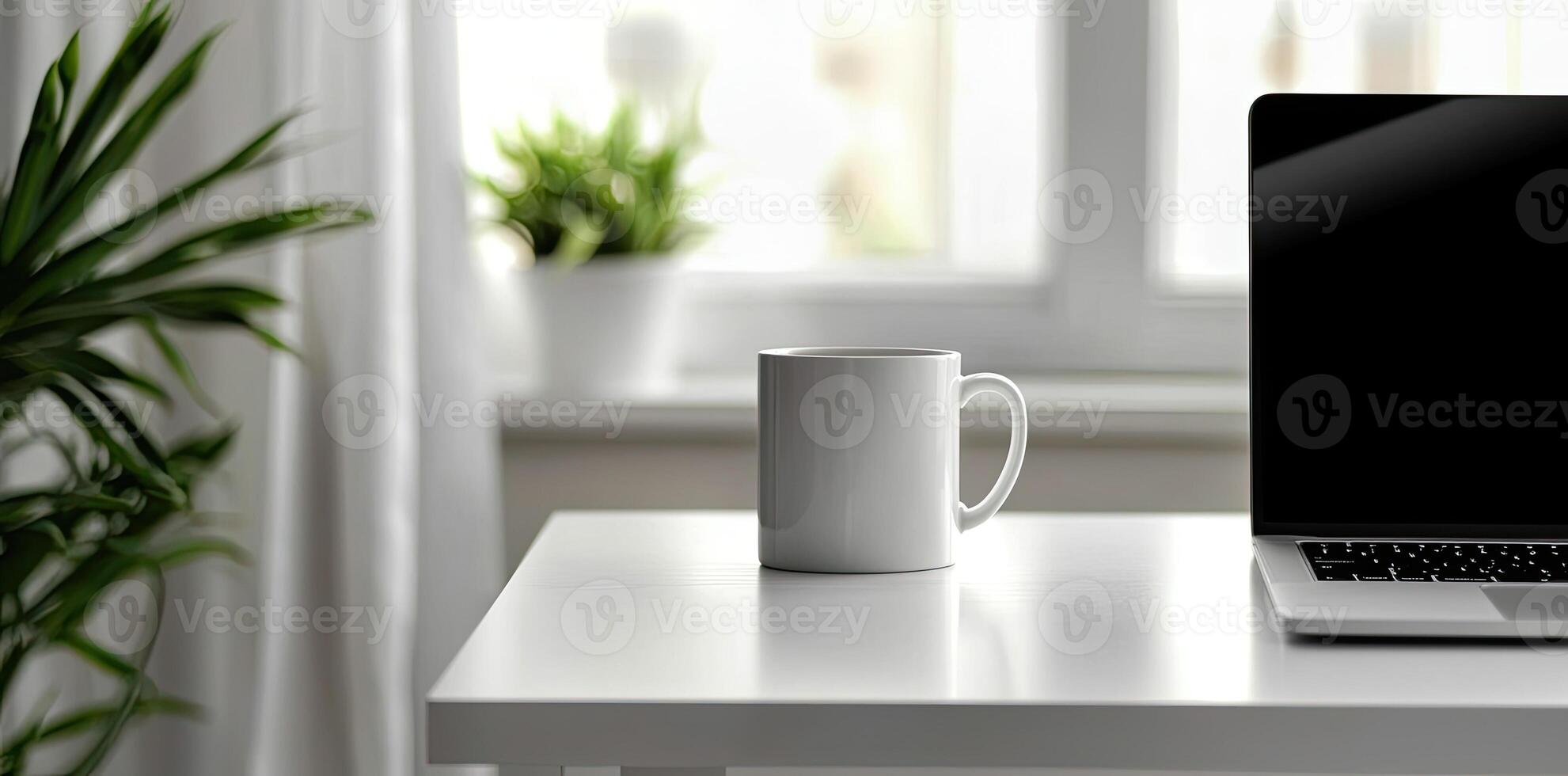 Minimalist white office desk with laptop and coffee mug on a blurred background, with space for text, representing the concept of working from home photo
