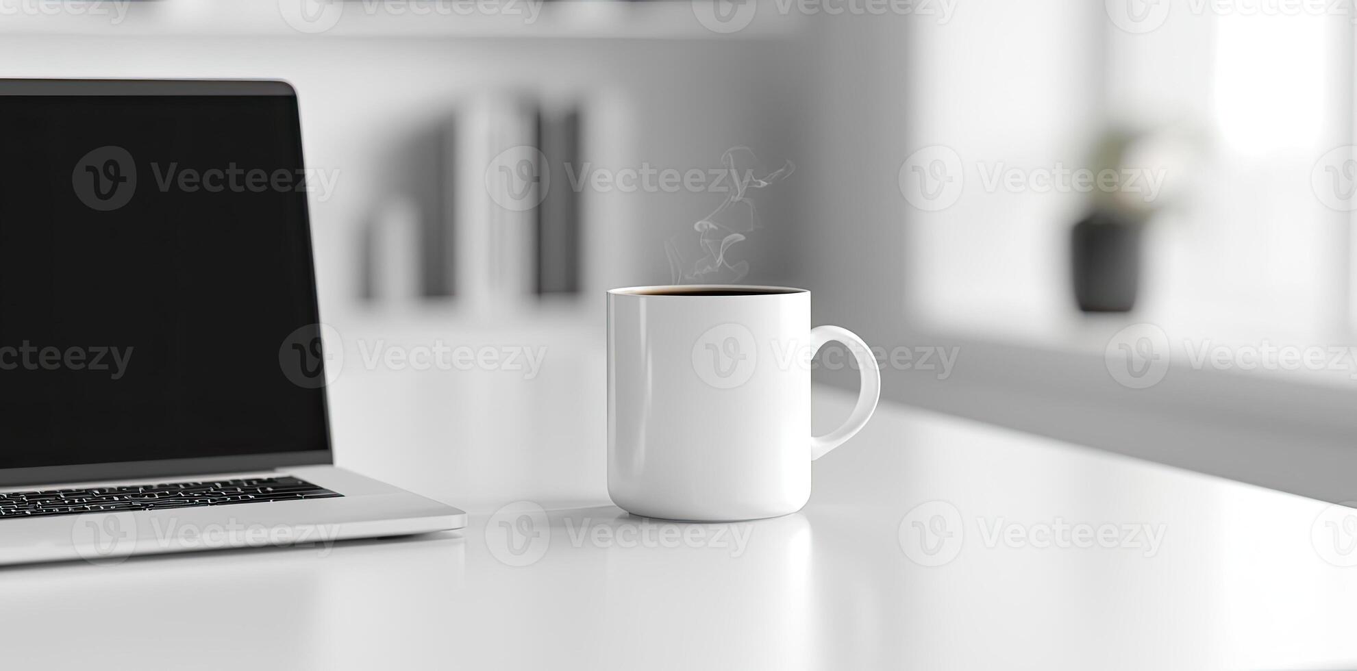 Minimalist white office desk with laptop and coffee mug on a blurred background, with space for text, representing the concept of working from home photo