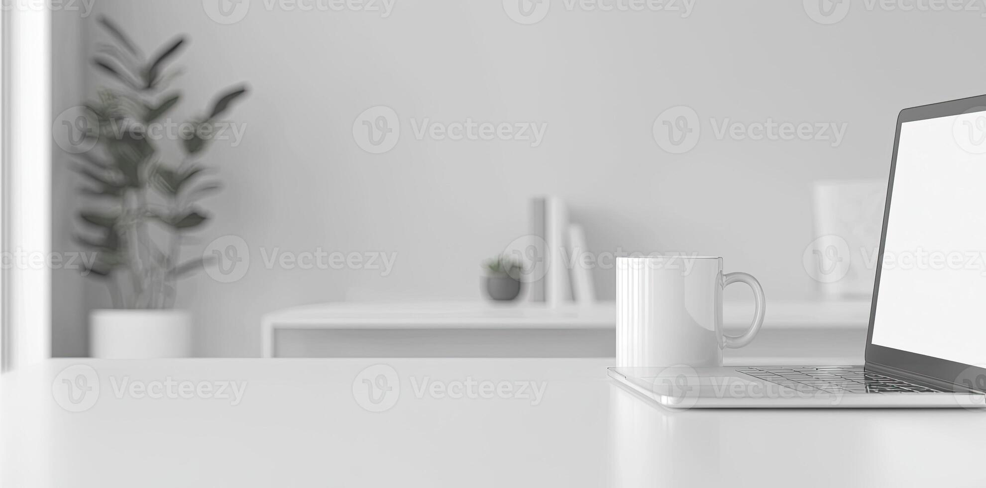 Minimalist white office desk with laptop and coffee mug on a blurred background, with space for text, representing the concept of working from home photo