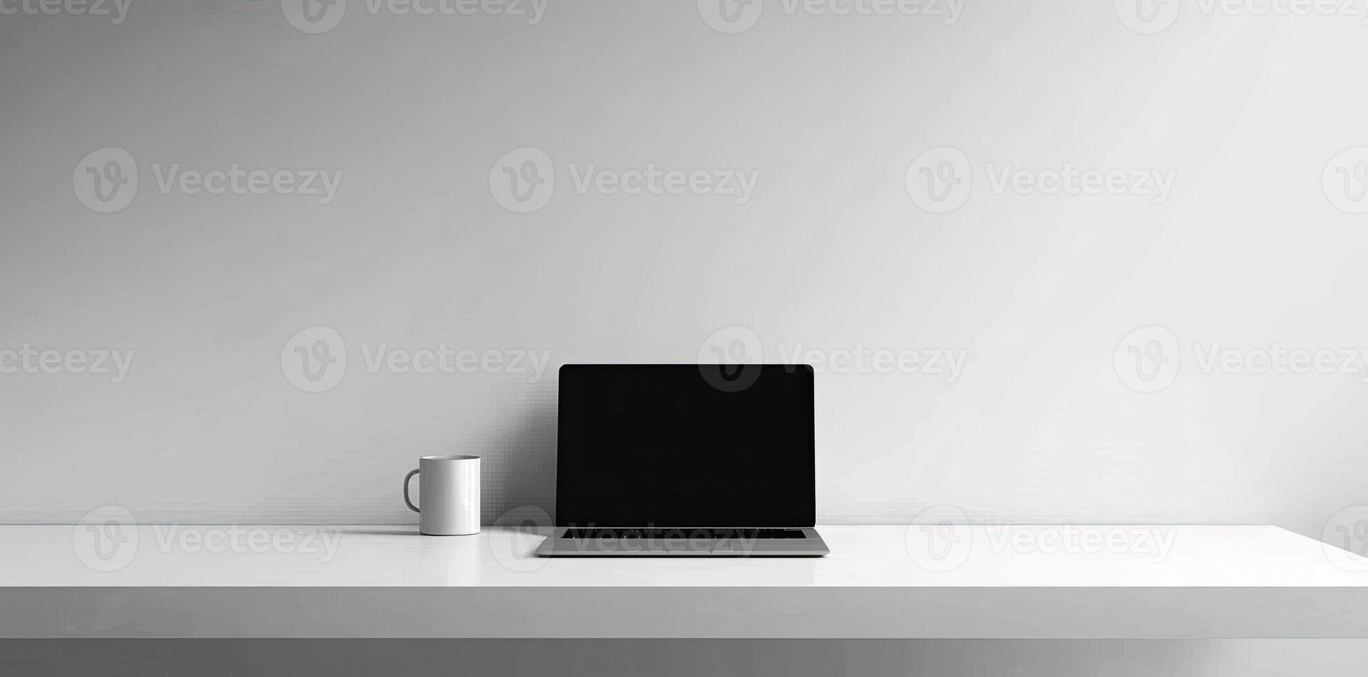 Minimalist white office desk with laptop and coffee mug on a blurred background, with space for text, representing the concept of working from home photo