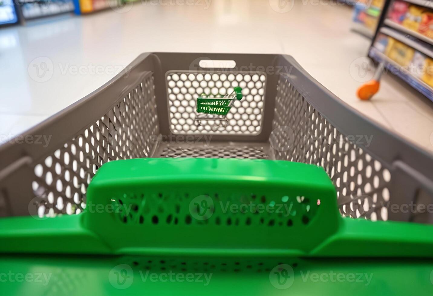 A shopping cart is shown in a supermarket aisle photo