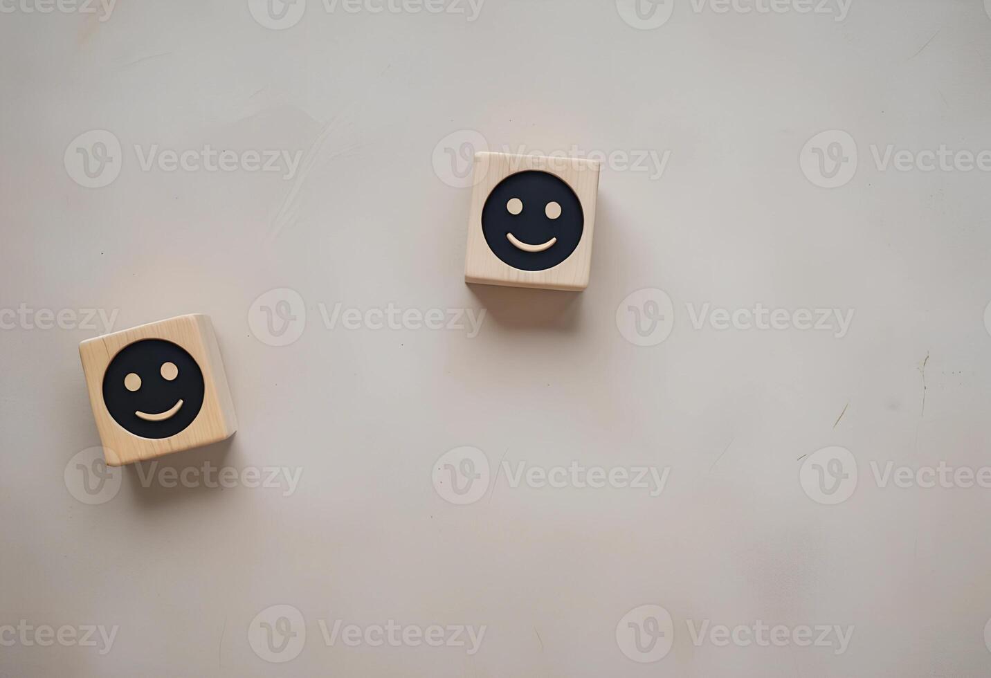 Two wooden blocks with smiley faces on them photo