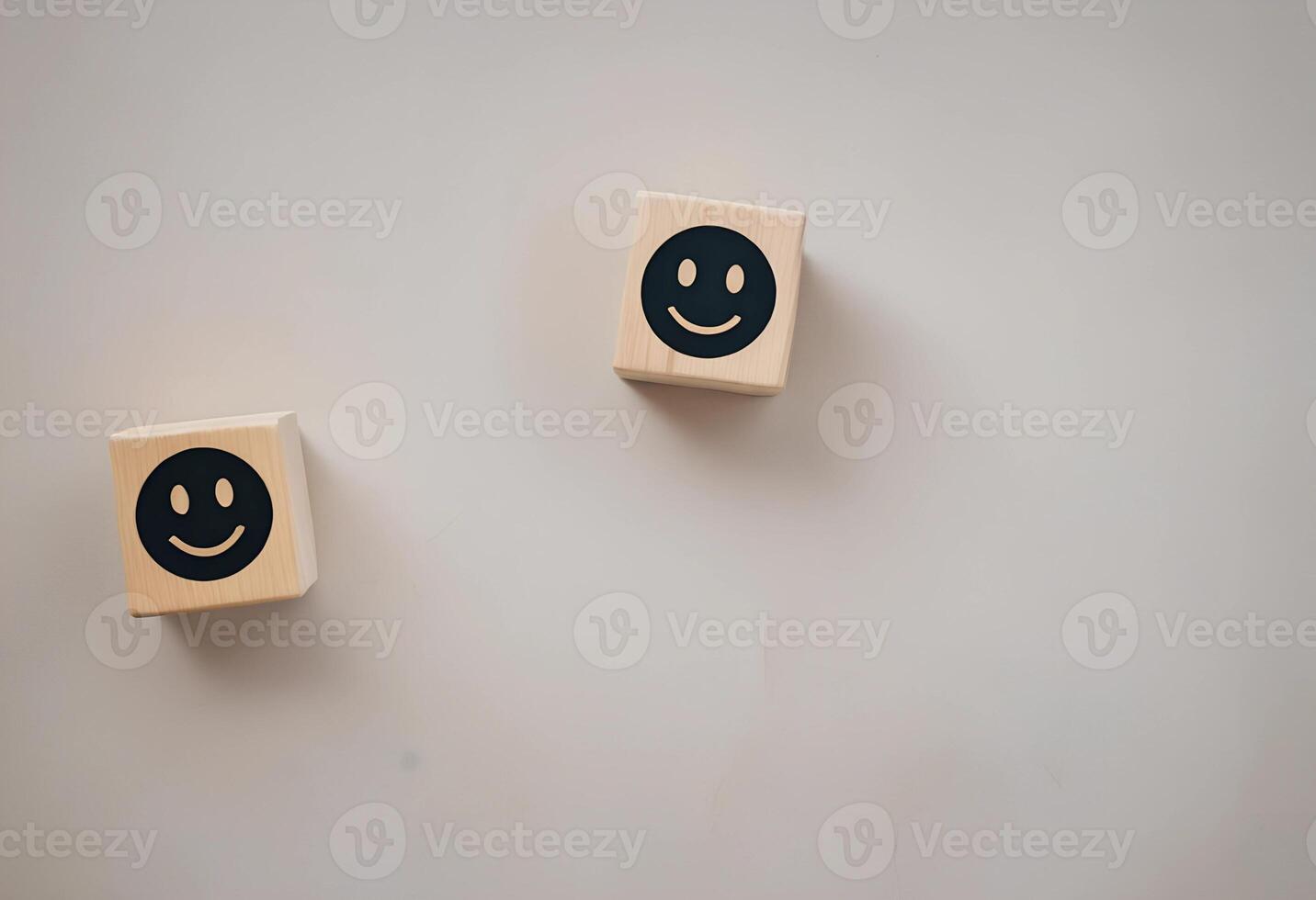 Two wooden blocks with smiley faces on them photo