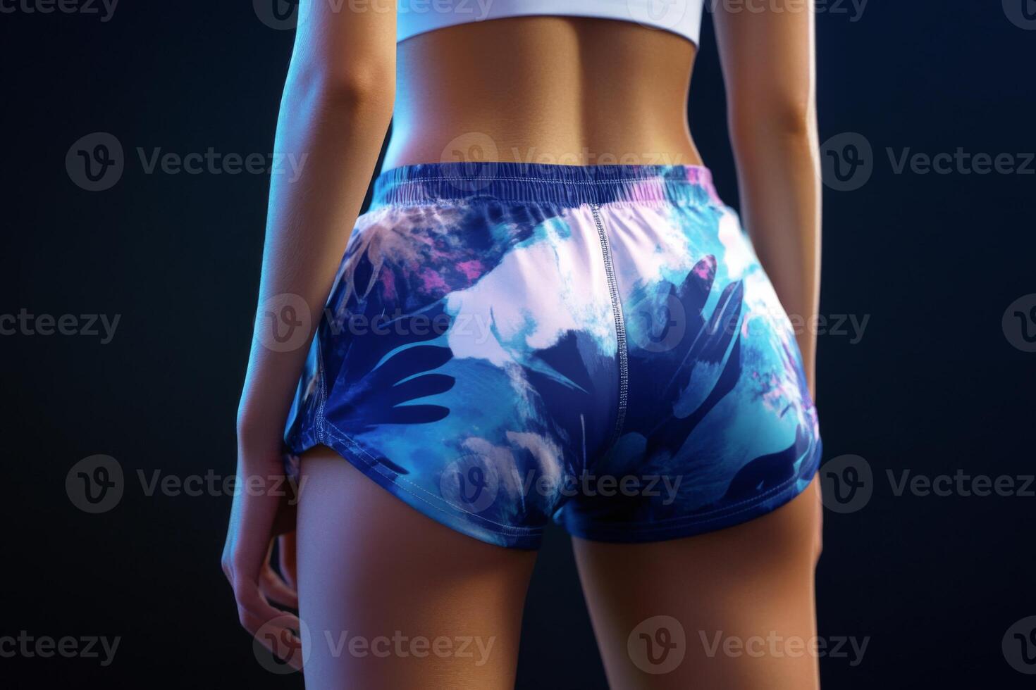 A fit woman dressed in stylish sporty shorts. Sporty buttocks in tight shorts photo