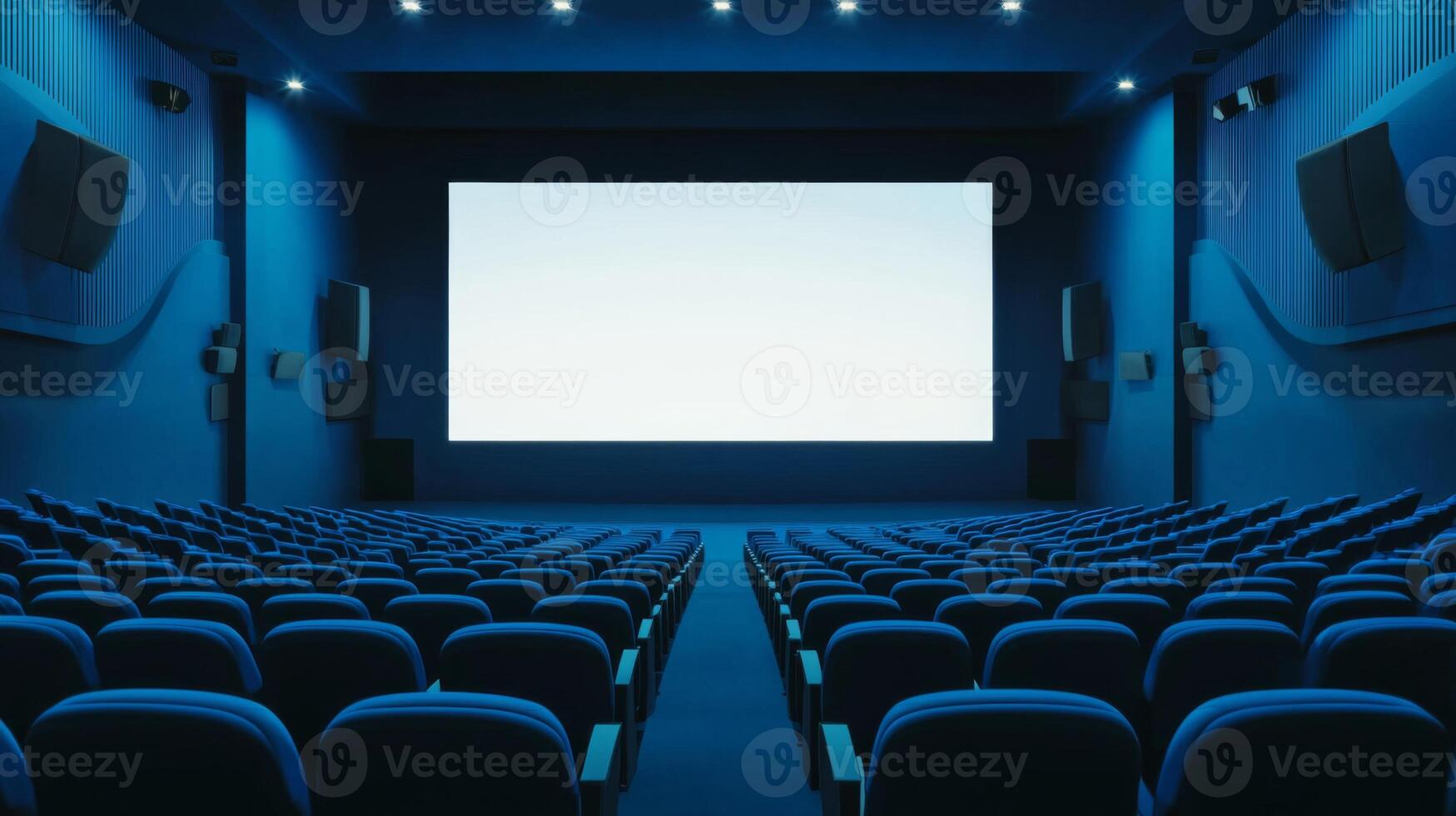 Empty cinema auditorium in blue color with white blank screen. Mockup of hall photo