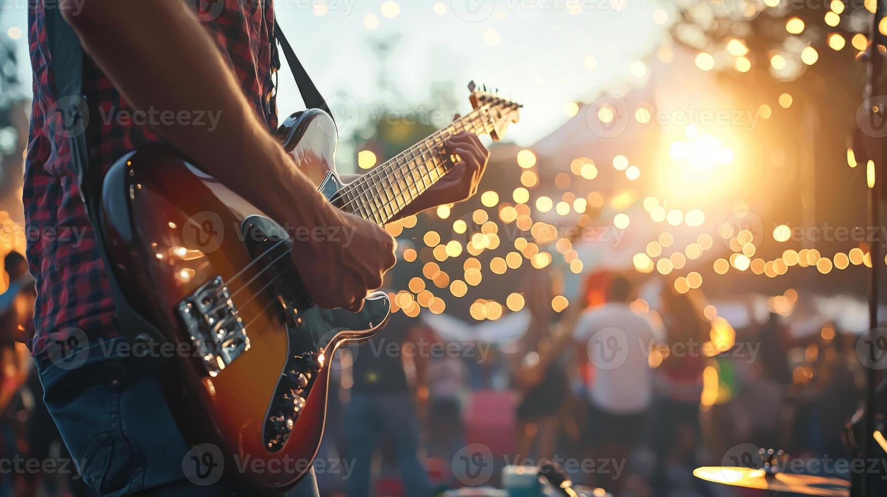 Musicians perform at Open Air Music Festival, man playing guitar with friends live music event photo