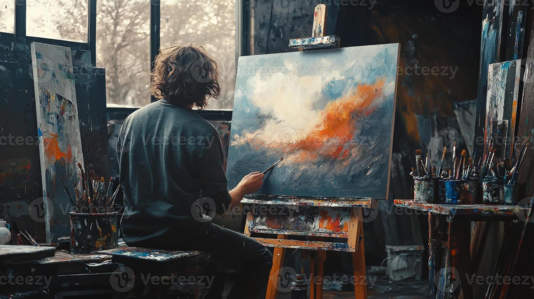Talented artist painting in studio, using paint brush creates modern masterpiece photo