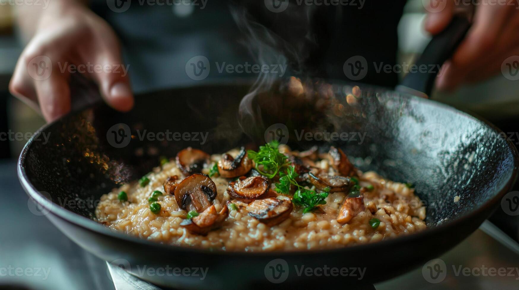 The chef prepares Risotto with mushrooms. Risotto with mushrooms is served in an elegant plate photo