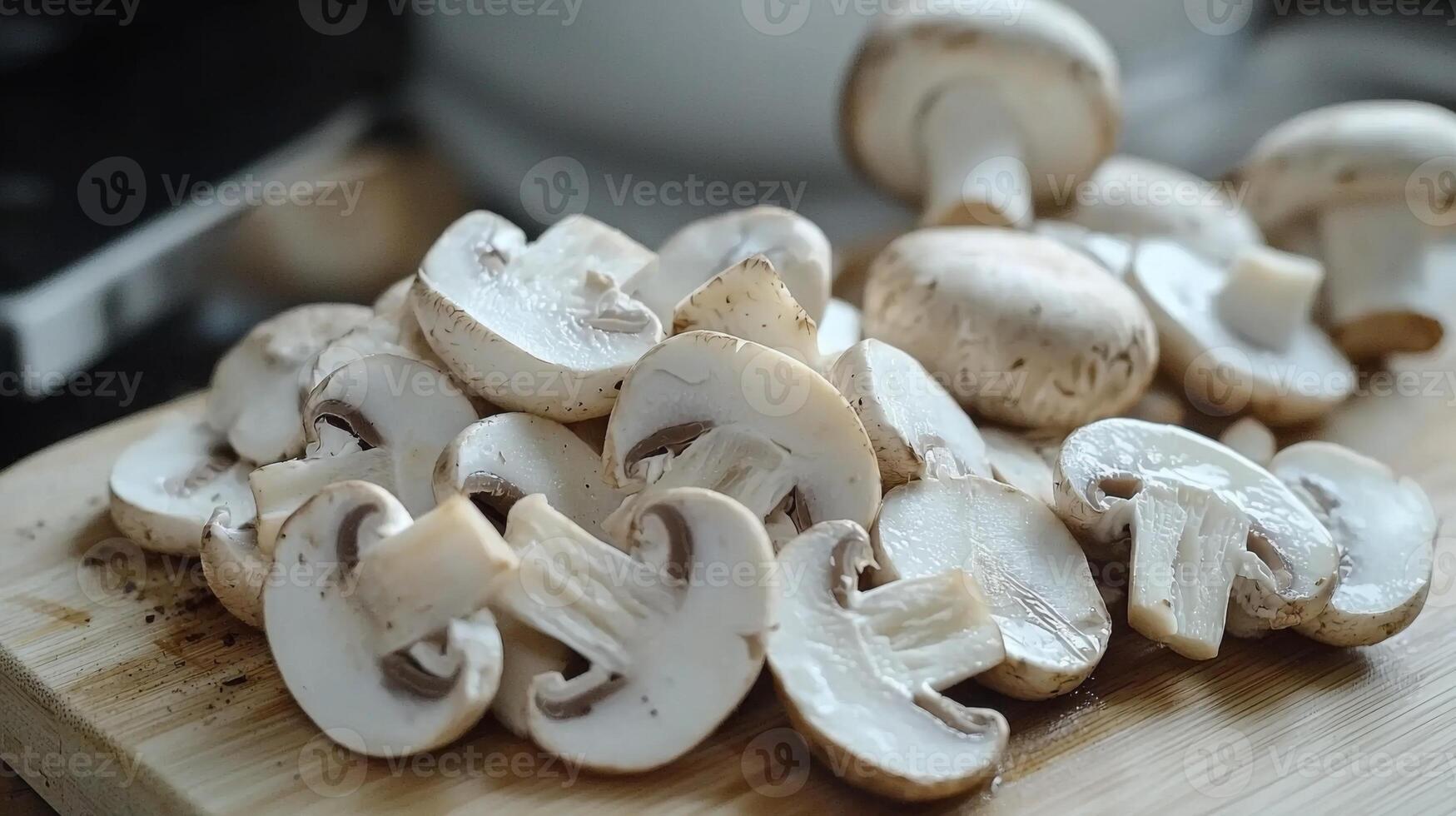 Sliced mushrooms ready for cooking on a cutting board photo