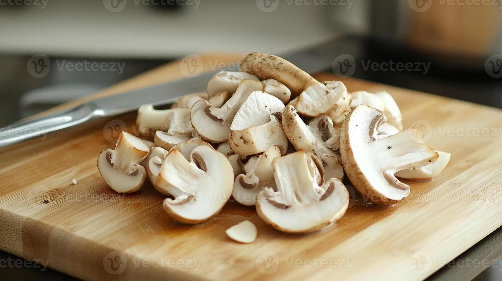 Sliced mushrooms ready for cooking on a cutting board photo