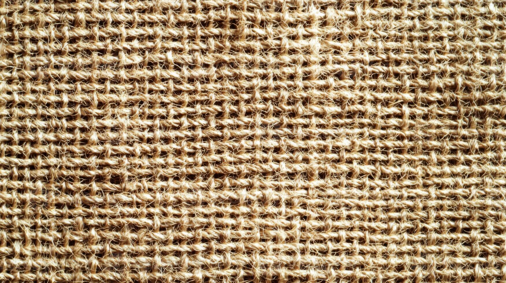 Burlap texture, background of scratchy burlack material in an even light brown color photo