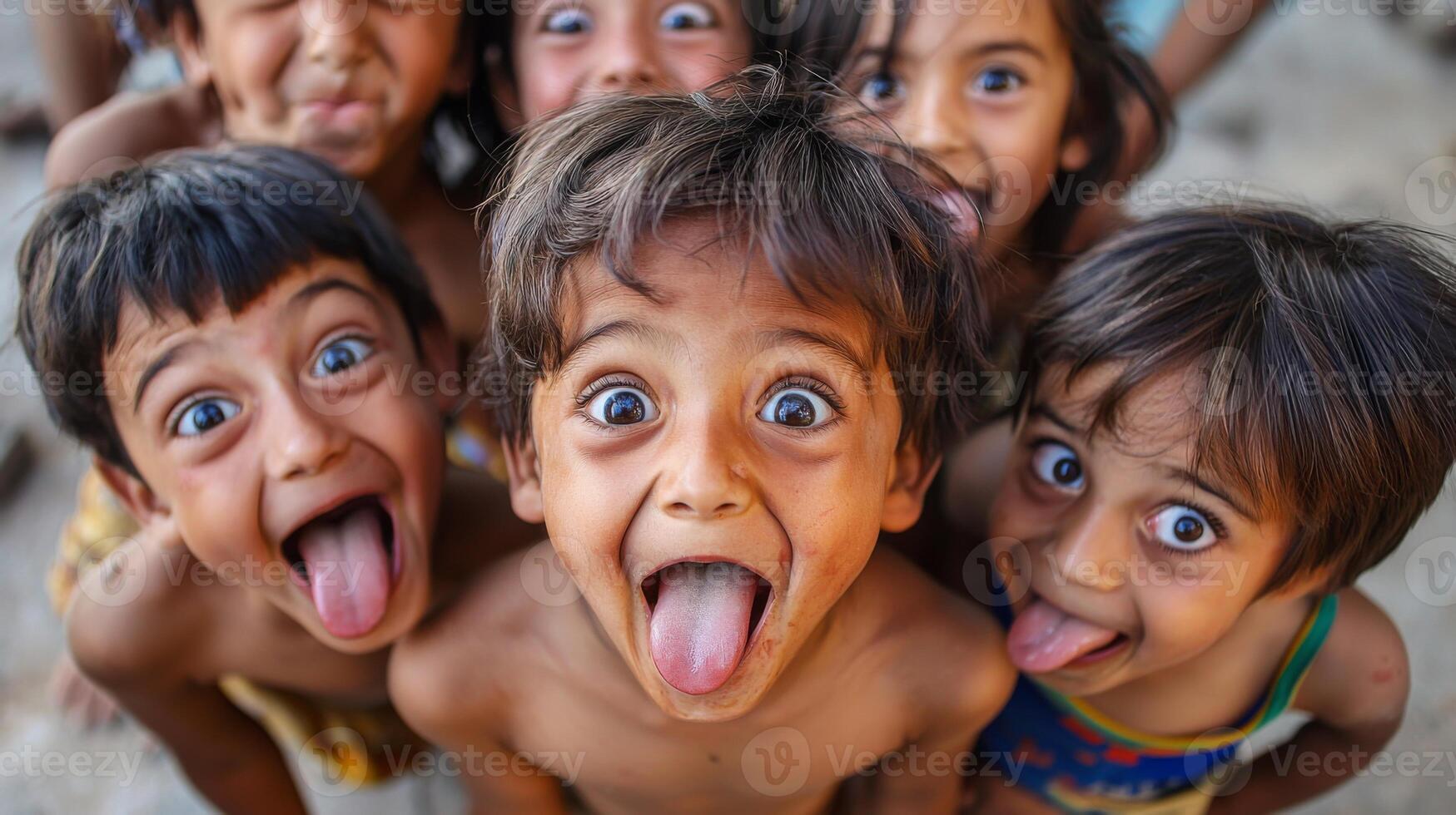 Children making silly and goofy faces, capturing the expressive gestures of their facial expressions photo