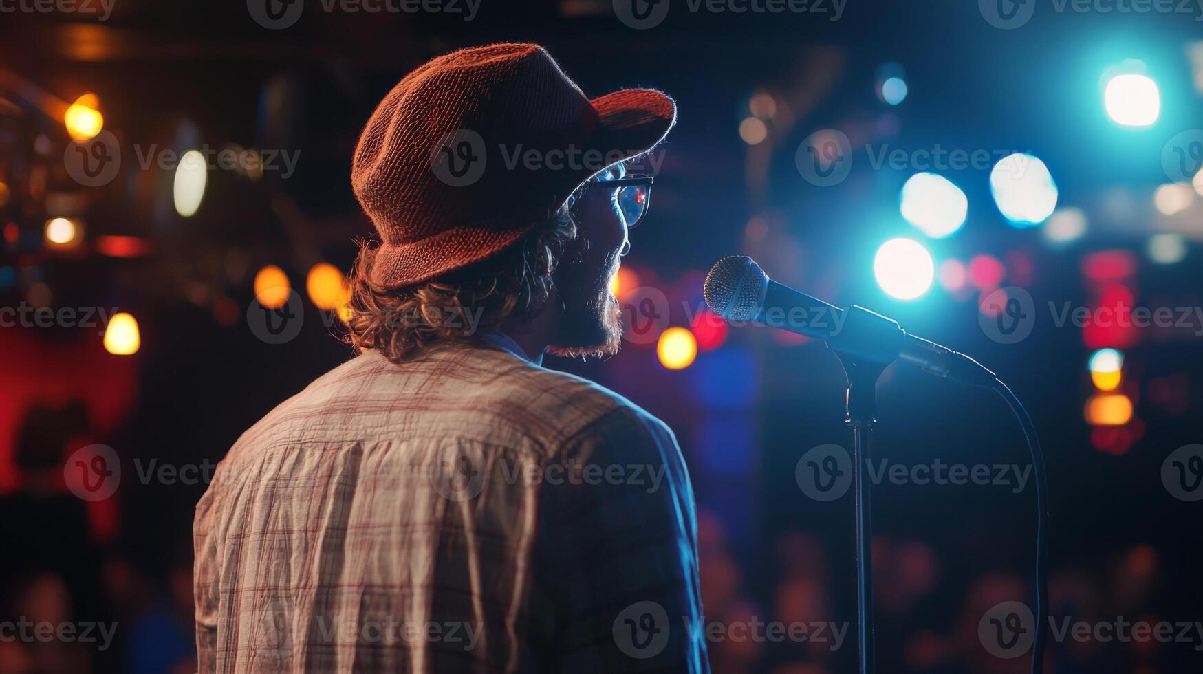 Comedian performing stand-up show on stage routine in comedy club photo