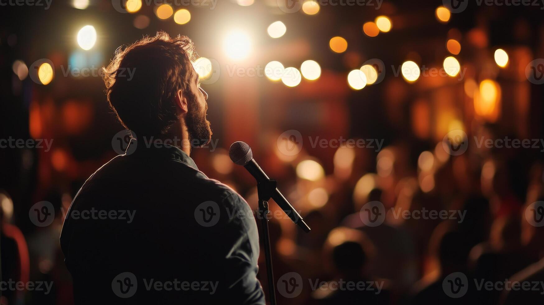 Comedian performing stand-up show on stage routine in comedy club photo