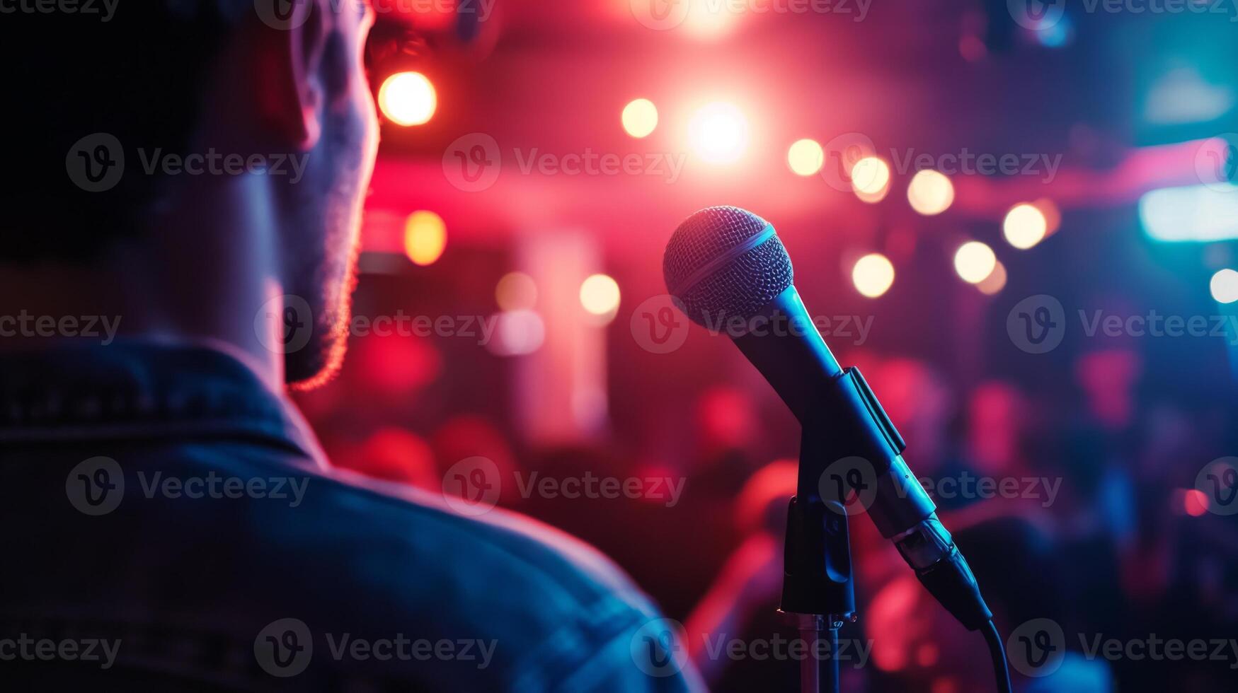 Comedian performing stand-up show on stage routine in comedy club photo
