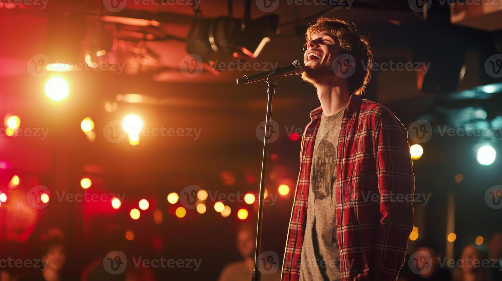 Comedian performing stand-up show on stage routine in comedy club photo