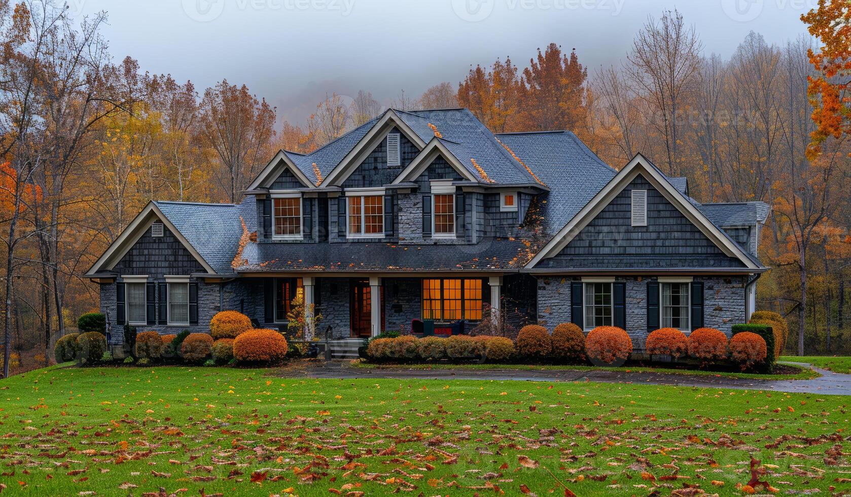 A large house with a lot of trees and a lot of leaves on the ground. The house is surrounded by a large yard with a lot of shrubs and trees photo